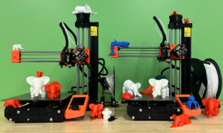 Two Prusa Mini 3D printers